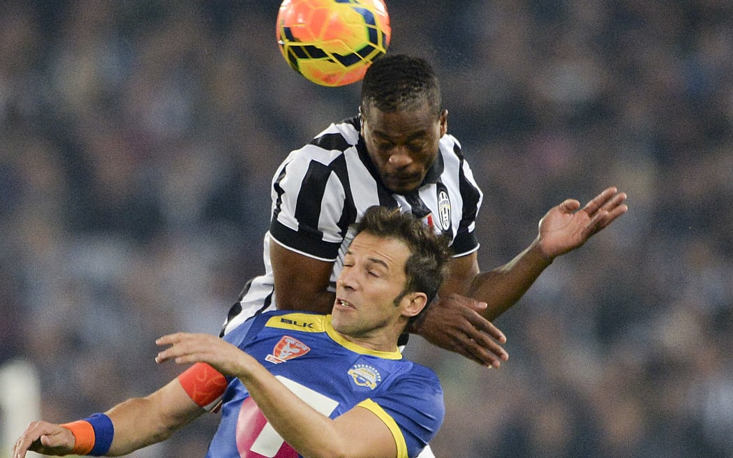 Patrice Evra of Juventus climbs above Alessandra Del Piero in an A League All Stars match.