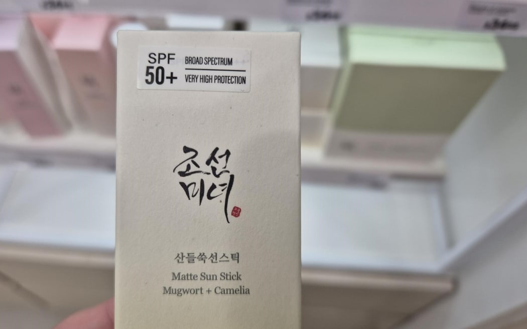 Beauty of Joseon sunscreen's sun stick package in Farmers shows an additional sticker applied that says "broad spectrum, very high protection".