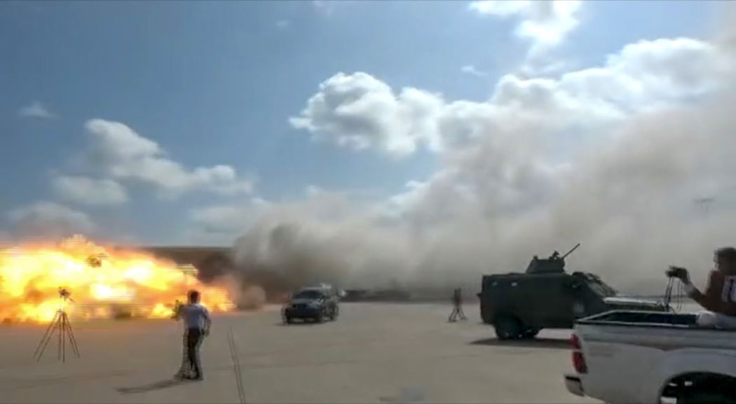 A video grab shows the moment an ordnance hit the airport in the southern Yemeni port city of Aden on December 30, 2020.