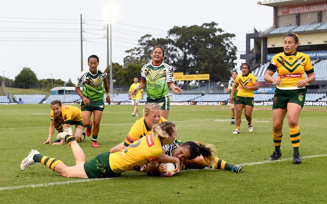Chantelle Inangaro Schofield scores a consolation try for the Cook Islands.