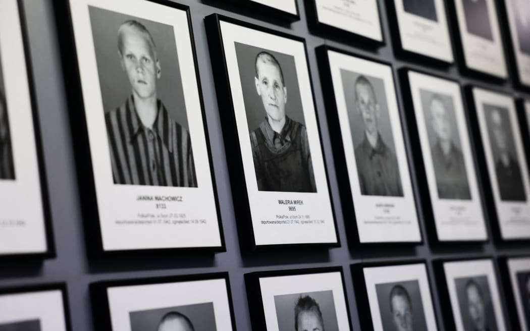 Portraits of prisoners are seen at the former Nazi German concentration camp Auschwitz-Brikenau in Oswiecim, Poland on 21 January 2025. (Photo by Jakub Porzycki/NurPhoto) (Photo by Jakub Porzycki / NurPhoto / NurPhoto via AFP)