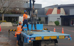 The statue of Captain John Fane Charles Hamilton being removed.