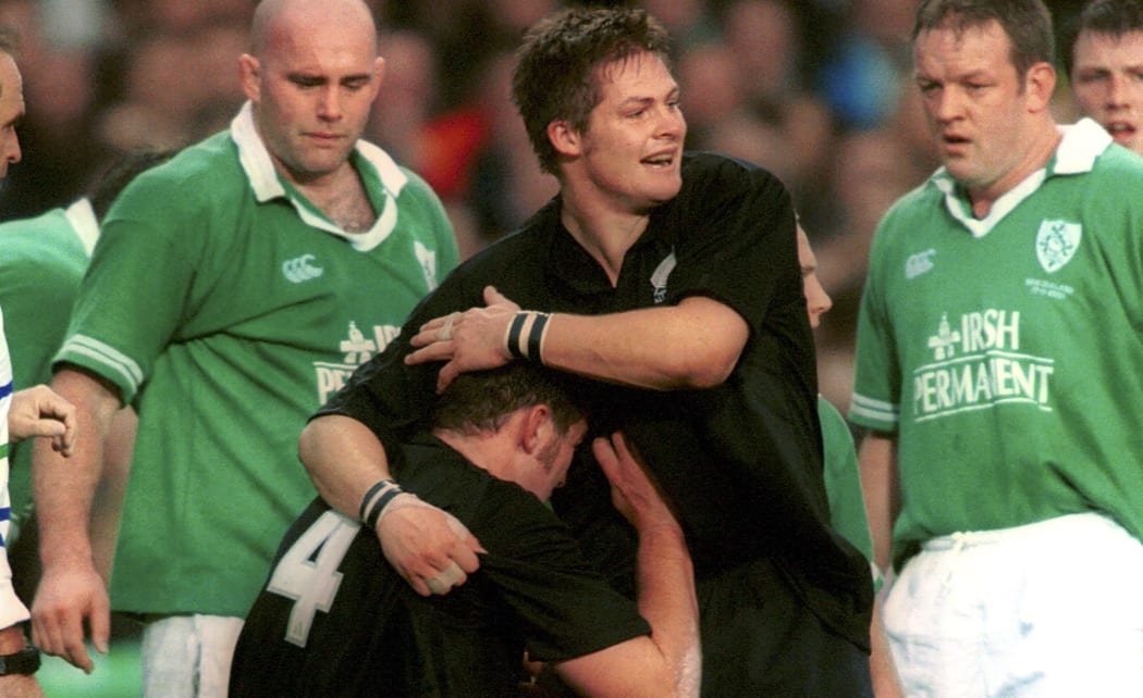 Richie McCaw congratulates Chris Jack after scoring a try against Ireland in 2001. The match was McCaw's test debut.
