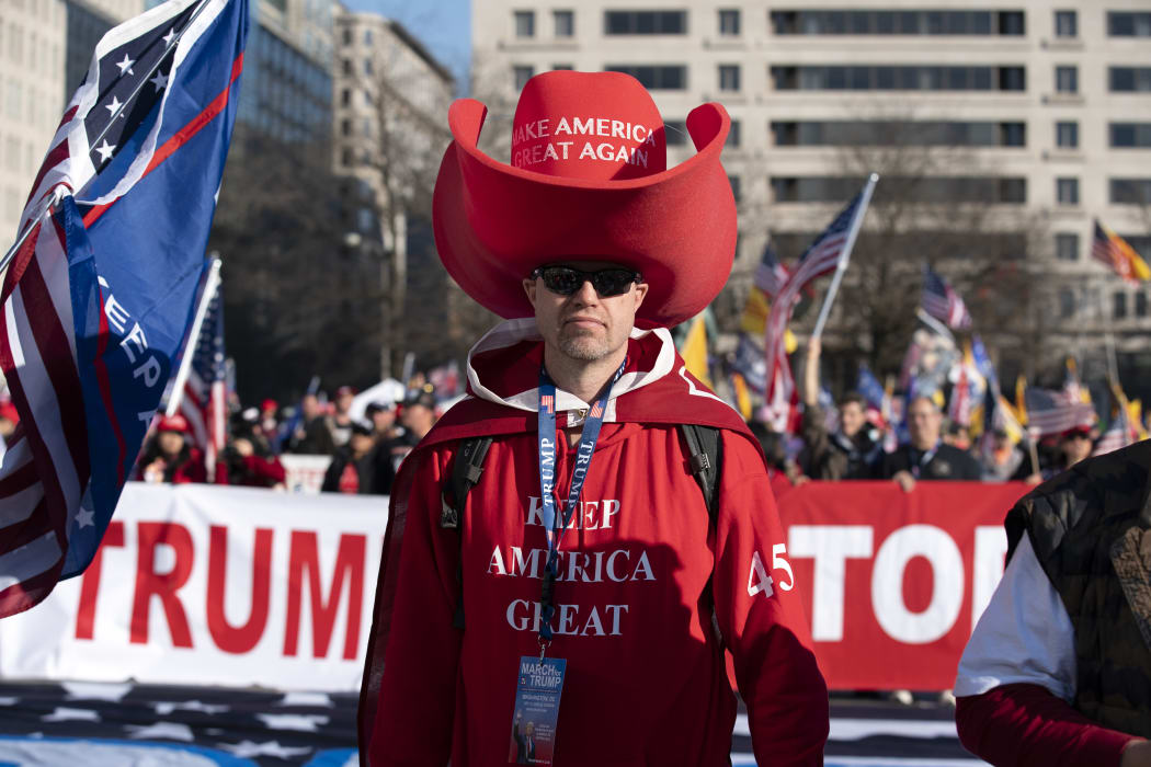Supporters of US President Donald Trump rally at Freedom Plaza to protest the outcome of the 2020 presidential election on December 12, 2020 in Washington, DC. (Photo by Jose Luis Magana / AFP)