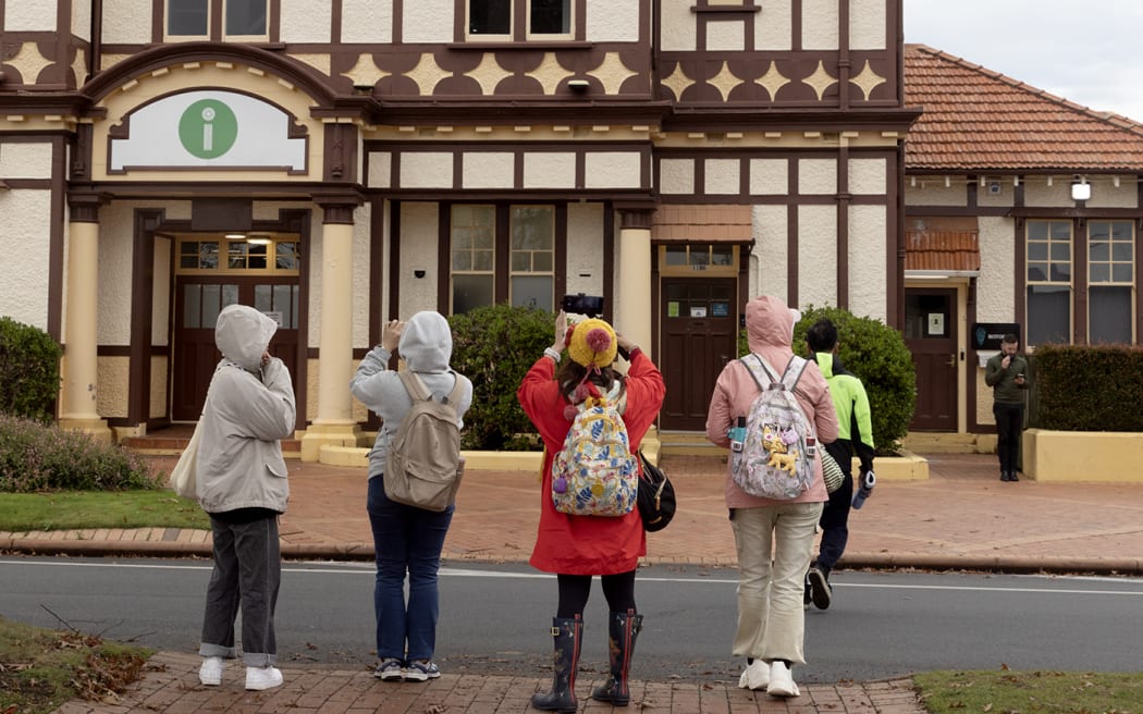 Tourist photograph the Tourism Rotorua building.  Photo / Andrew Warner