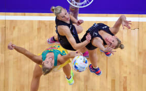 Silver Ferns defenders Casey Grant (left) and Casey Kopua battle it out with Australia shooter Caitlin Bassett.