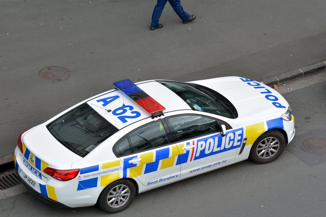 AUCKLAND - MAR 30 2017:New Zealand Police car and officer during a crime respond in Auckland, New Zealand.