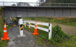 Waters are visibly rising at Waitotara River, where the underpass has been closed due to the threat of flooding.