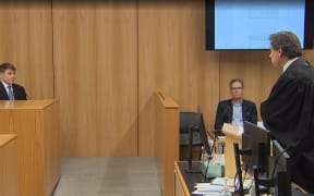 TVNZ reporter Thomas Mead (L) is questioned by Brian Dickey KC (R) while Tim Murphy of Newsroom looks on.