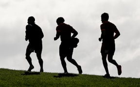 Aaron Smith, Richie Mo'unga and Beauden Barrett after an All Blacks training session on 29 June ahead of the test match against Tonga.