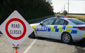 The scene of a crash where four people died after a truck and van collided near Ashburton.