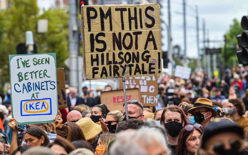 People attend a protest against sexual violence and gender inequality in Melbourne on March 15, 2021.