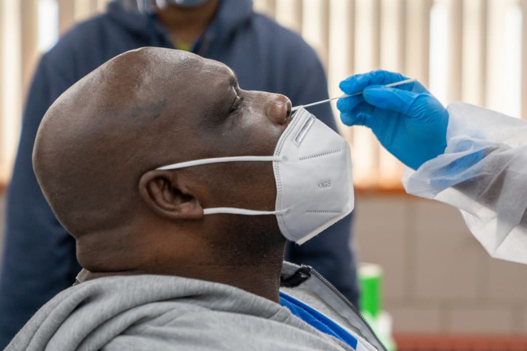 NEW YORK, NY - OCTOBER 30: Michael Stanley an employee for the MTA, is administered a COVID-19 test on October 30, 2020 in New York City.