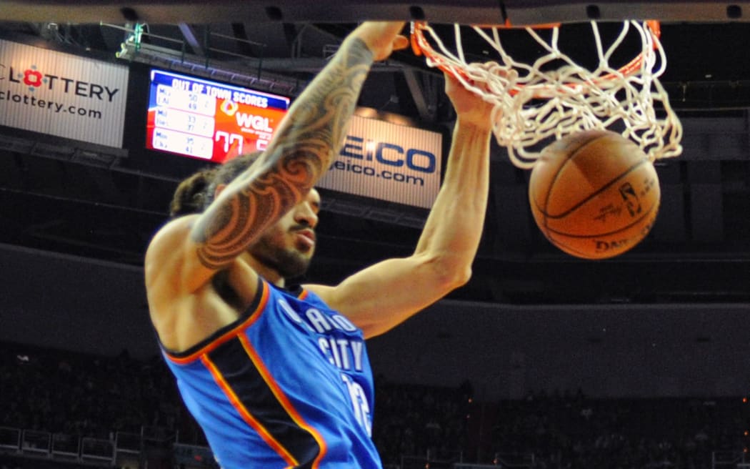 The Thunder's Steven Adams dunks the ball.