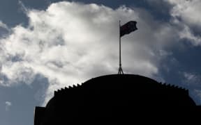 The Beehive in silhouette against a cloudy blue sky.
