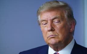 US President Donald Trump looks down during an event on lowering prescription drug prices in the Brady Briefing Room of the White House in Washington, DC on November 20, 2020.