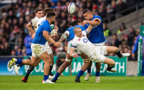 England's Mike Brown drops the ball after being tackled by Alapati Leiua.