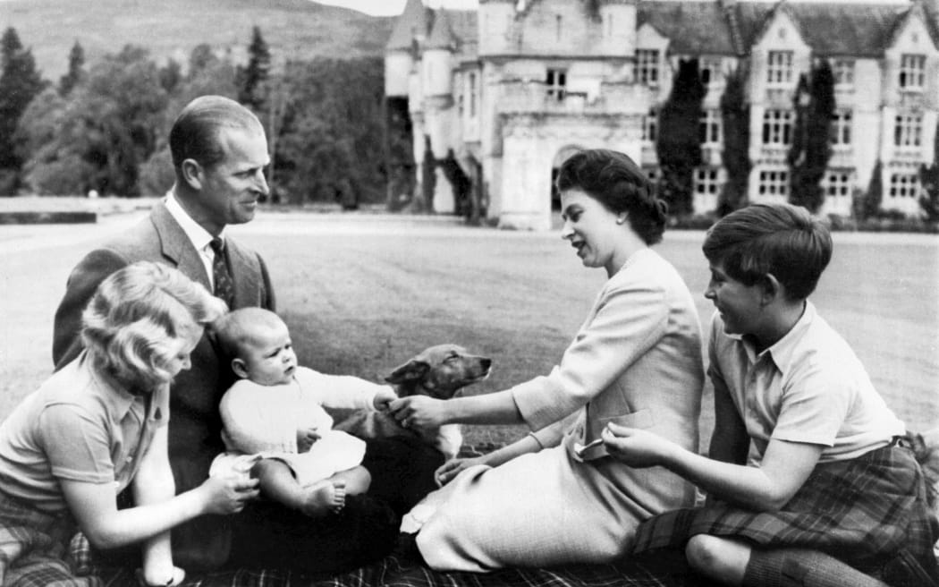 A photo taken on 9 September 1960 Britain's Queen Elizabeth II (2R), Britain's Prince Philip, Duke of Edinburgh (2L) and their three children Prince Charles (R), Princess Anne (L) and Prince Andrew (3L) pose in the grounds of Balmoral Castle, near the village of Crathie in Aberdeenshire.