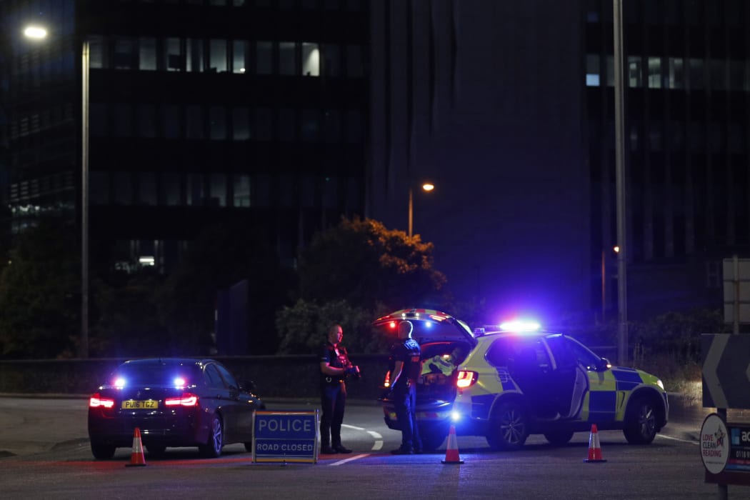 Police secure a cordon near Forbury Gardens park in Reading, west of London, on June 20, 2020 following a stabbing incident.