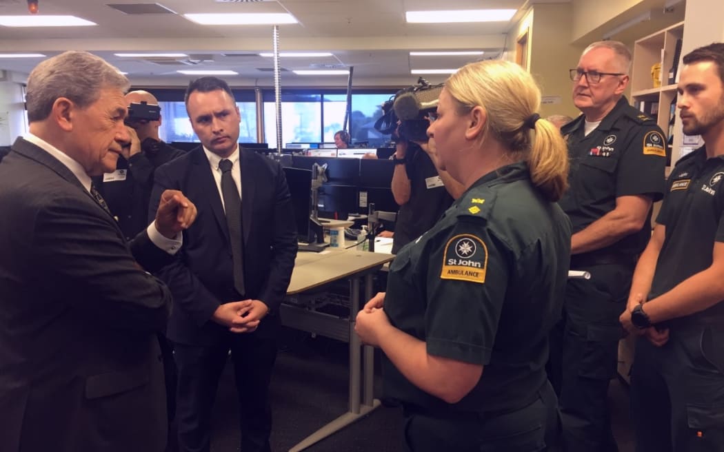 Winston Peters speaks with St John staff as work starts on rebuilding the service's call centre.