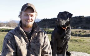 030916 Photo: Richard Cosgrove/Fish & Game New Zealand
NZ Live Duck Calling champion Hunter Morrow and his steadfast companion Teal at home in Luggage, Central Otago.