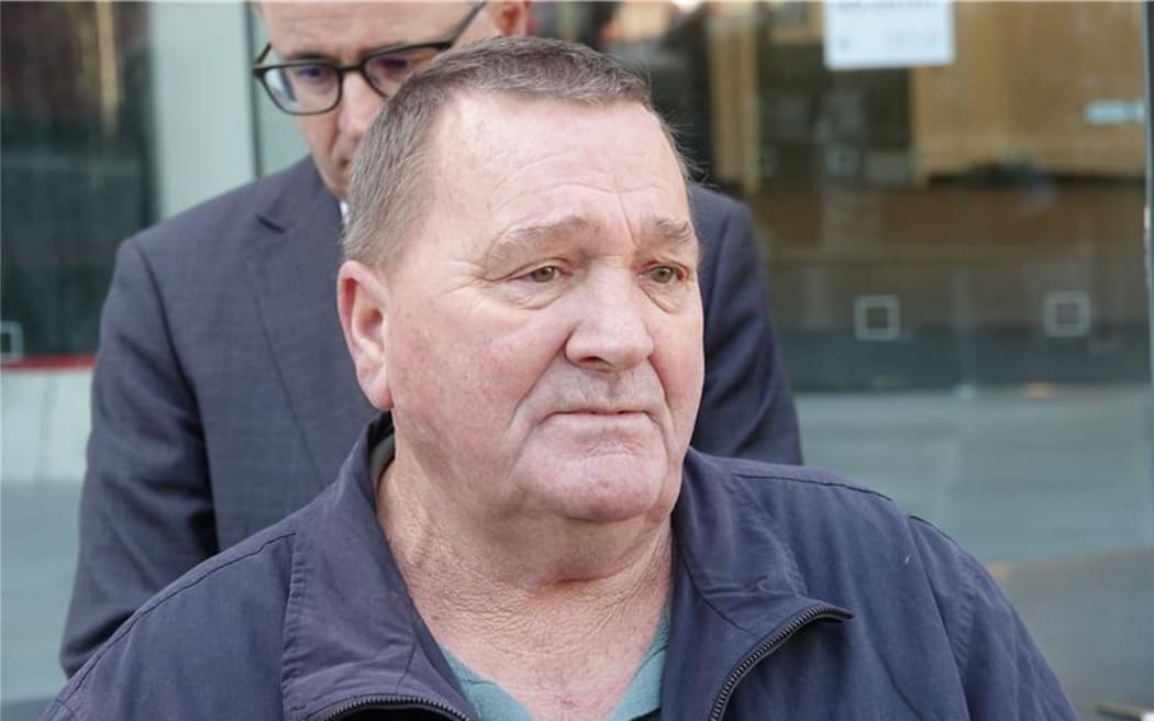 Malcom Richards standing outside the court after filing a judicial review against the government's redress offer