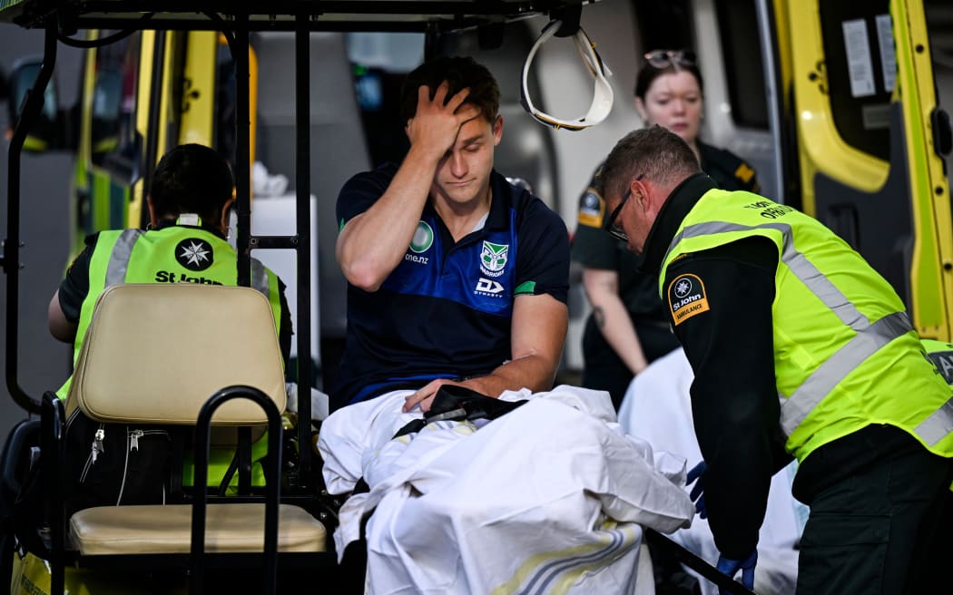 Luke Metcalf is taken to hospital after breaking his leg.