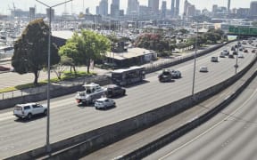 Cars towing boats travel across the city on Saturday morning.