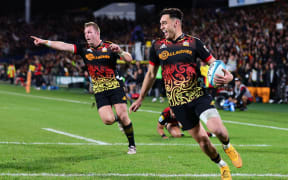 Shaun Stevenson scores a try for the Chiefs during the Super Rugby Pacific final against the Crusaders.