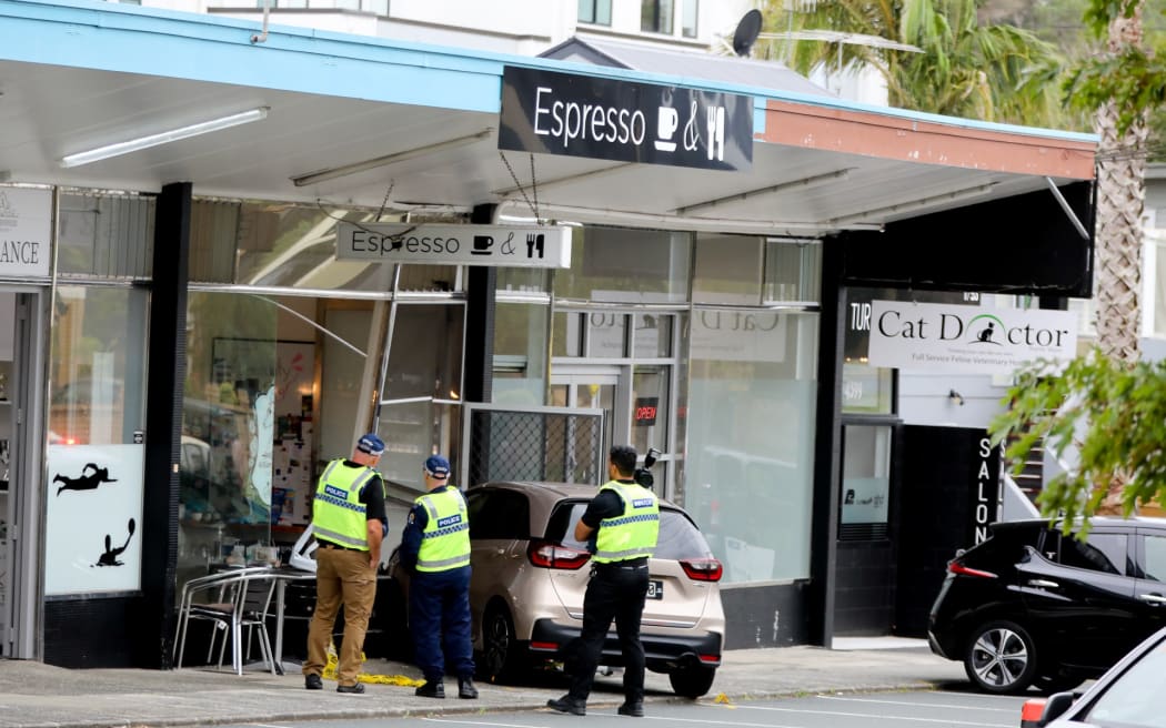 A woman at an Auckland cafe has been left bleeding and with life-threatening injuries after a car crashed into the building in Auckland.