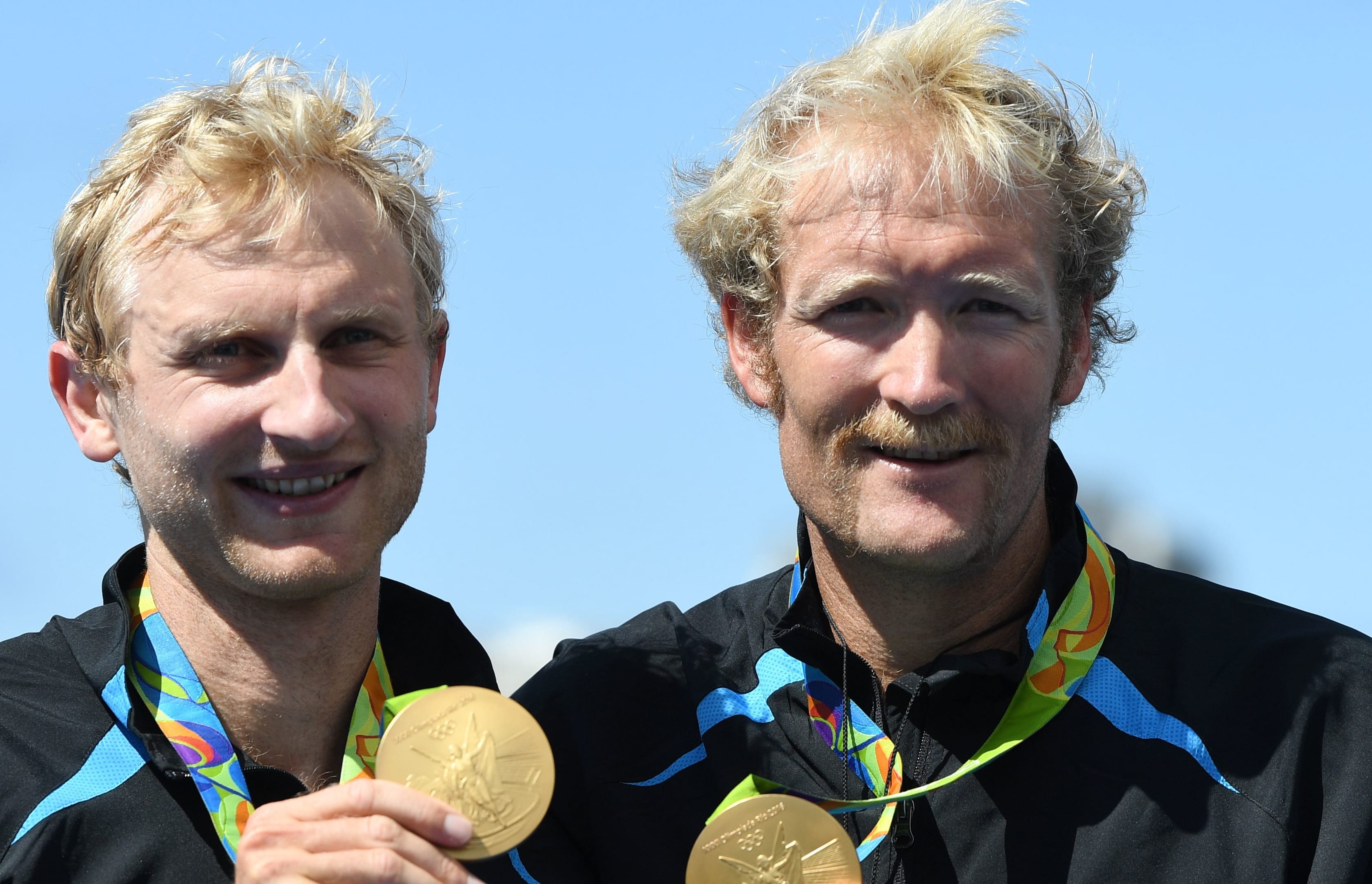 Hamish Bond, left, and Eric Murray celebrate with their gold medals on the podium after wining the Men's Pair Final of the Rowing events of the Rio 2016 Olympic Games at Lagoa Stadium in Rio de Janeiro, Brazil, 11 August 2016.