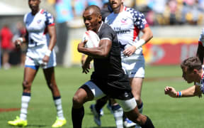 Fiji sevens captain Osea Kolinisau finds open space against the USA.
