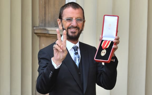 Richard Starkey, better known as Ringo Starr, poses with his medal after being appointed Knight Commander of the Order of the British Empire at an investiture ceremony at Buckingham Palace in London.