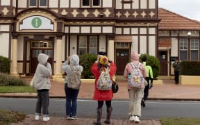 Tourist photograph the Tourism Rotorua building.  Photo / Andrew Warner
