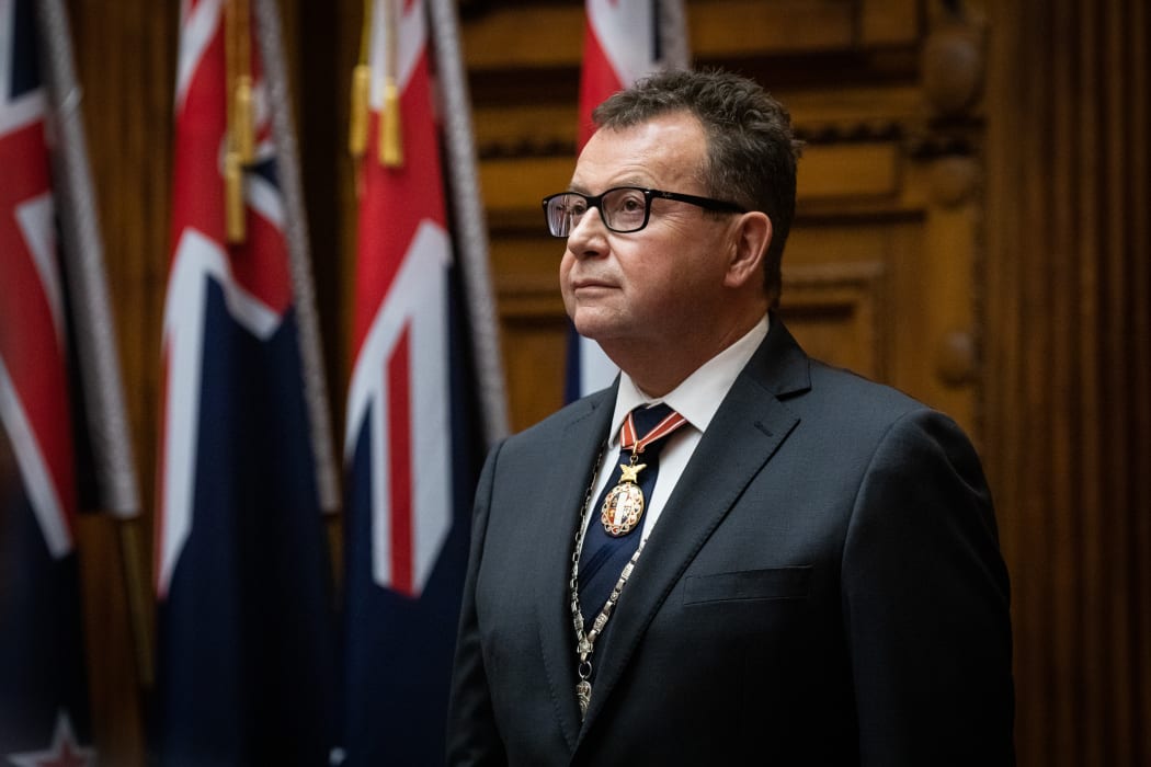 Secretary of the Cabinet and Clerk of the Executive Council Michael Webster stands for the National Anthem