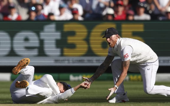 England's Jacob Bethell (left) drops a catch on the first day of the fourth Ashes cricket Test match between Australia and England at the Melbourne Cricket Ground on 26 December, 2025.