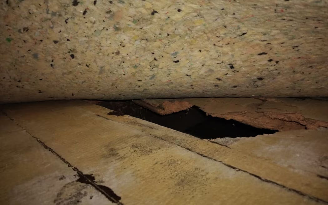 Holes in the floor were covered with furniture for safety.
