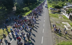 Aerial view of Honduran migrants heading in a caravan to the US, on the road linking Ciudad Hidalgo and Tapachula, Chiapas state, Mexico.