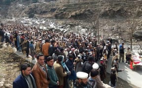 Pakistani residents offer funeral prayers beside the coffin of Afzal Kohistani, who was killed by gunmen, in Battagram District in Khyber Pakhtunkhwa Province.