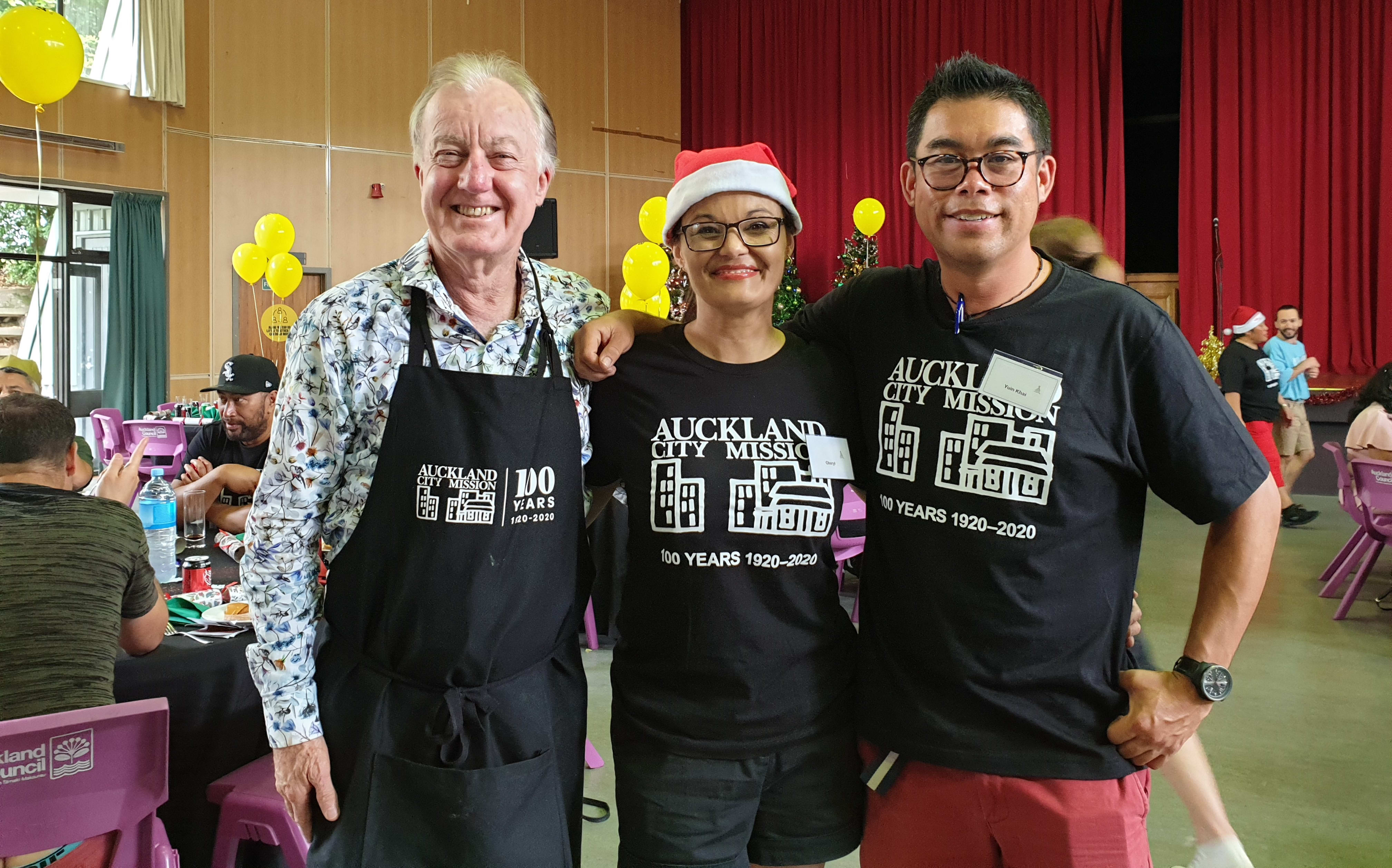 Auckland City Missioner Chris Farrelly, with long time volunteers Cheryl Jenkins and Yuin Khai Foong, who say it's great to see people coming together on Christmas.