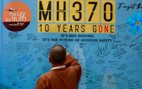 Visitors are writing messages at the Day of Remembrance for MH370 in Petaling Jaya, Malaysia, on March 3, 2024. Today marks the 10th anniversary of the disappearance of Flight MH370, a Boeing 777 aircraft with 239 people on board, which vanished from radar screens on March 8, 2014, while flying from Kuala Lumpur to Beijing. (Photo by Supian Ahmad/NurPhoto) (Photo by Supian Ahmad / NurPhoto via AFP)