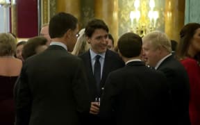 Dutch Prime Minister Mark Rutte (L), French President Emmanuel Macron (front), British Prime Minister Boris Johnson (R) and Canada's Prime Minister Justin Trudeau (back centre) were heard making remarks  at a Buckingham Palace reception, reportedly about Donald Trump.