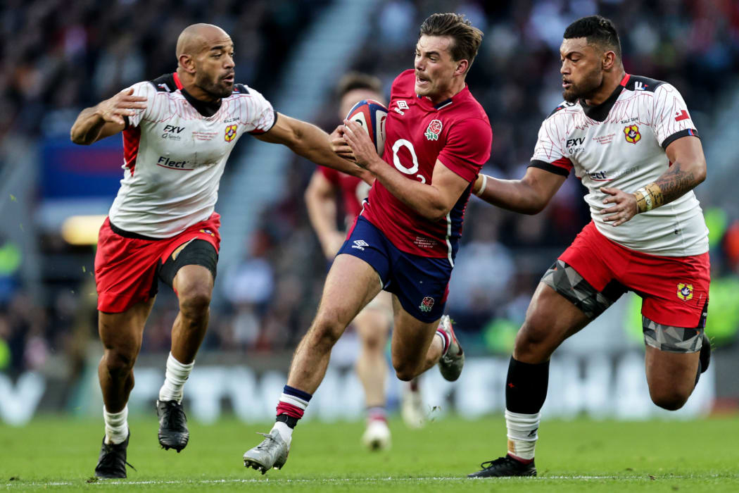 Tonga's Afusipa Taumoepeau and Walter Fifita try to shut down England's George Furbank.