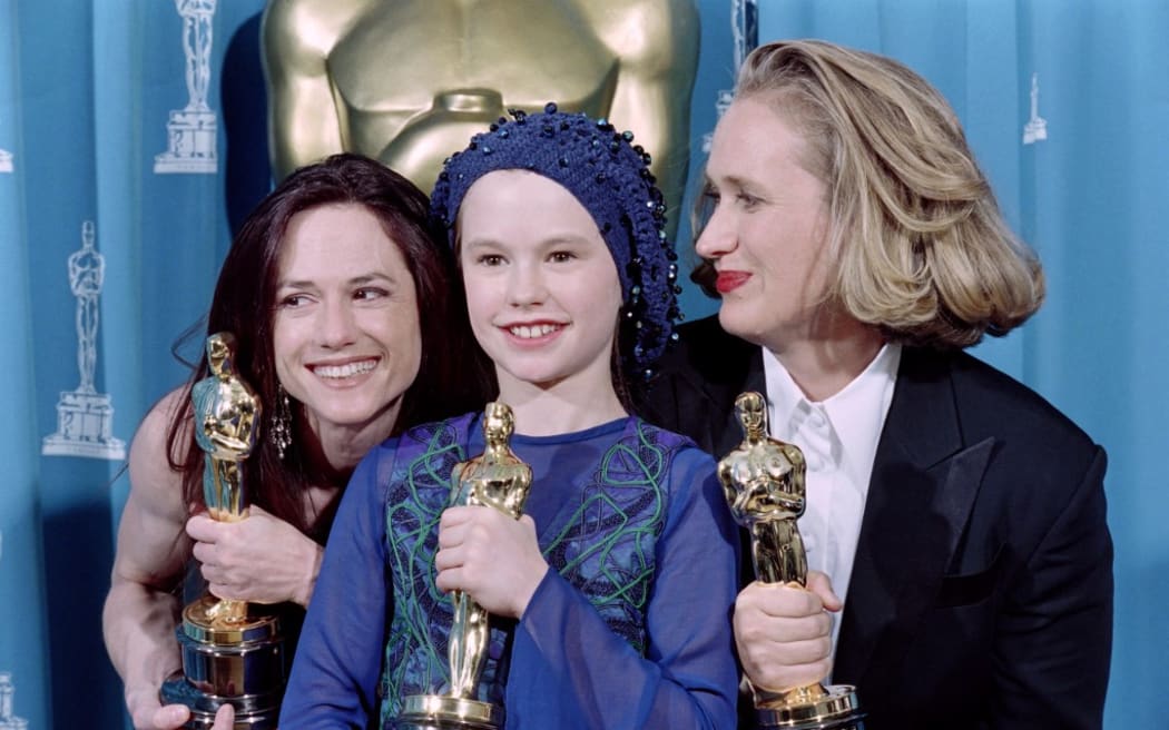 US actress Holly Hunter (L), New Zealand's director Jane Campion (R) and actress Anna Paquin pose with their Oscars after winning respectively the awards for best actress, best original screenplay and best supporting actress for the movie "The Piano" in Los Angeles on March 21, 1994.