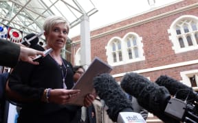 Family spokesperson Ruth Money speaking to media outside the High Court in Auckland.