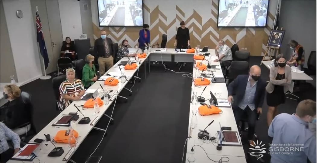 Gisborne Mayor Rehette Stoltz adjourns the council meeting and five councillors, right, make for the door. Other councillors turned away, while some continued to watch.