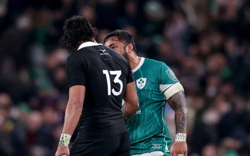 New Zealand’s Rieko Ioane speaks with Bundee Aki of Ireland after the game.
