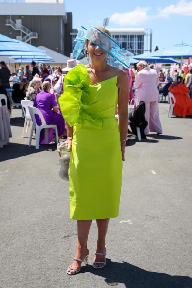 Megan Bryant wearing a dress from Aaliyah and fascinator from TradeMe at the New Zealand Trotting Cup at Addington Raceway on 11 November, 2025.