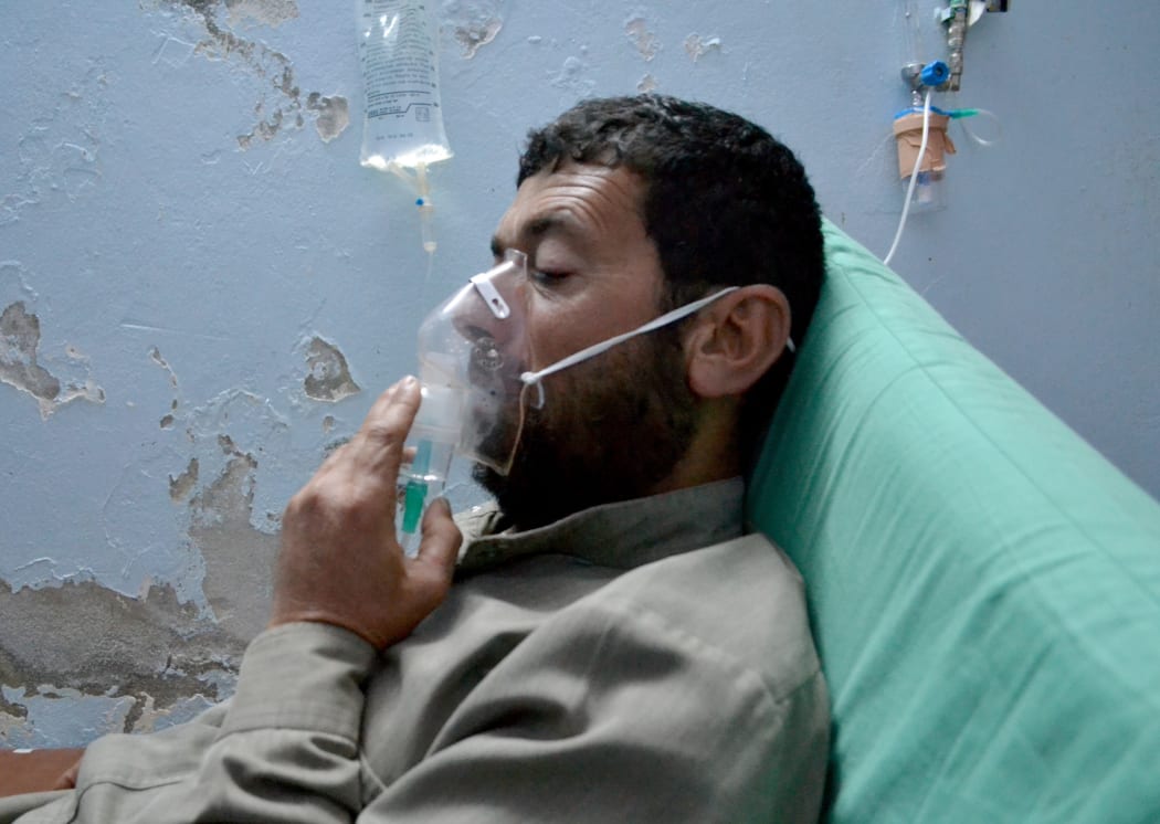A Syrian man receives treatment at a field hospital following a suspected chlorine gas attack by Assad regime forces in Idlib, Syria on May 03, 2015.