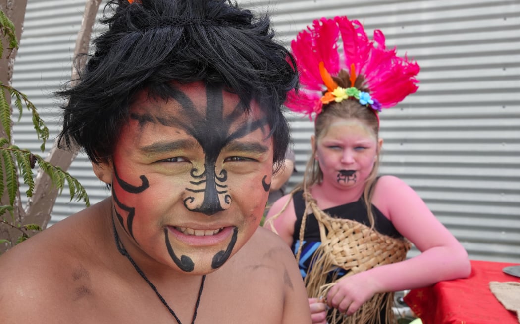 Ngakau Hansen, 11, as Tamanuiterā, and Eva Candy, 10, as Hineraumati on Kāeo Primary School’s float.